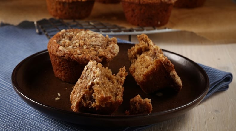 Rolled oats bring texture to a crumble that tops muffins spiked with cinnamon and nutmeg. (E. Jason Wambsgans/Chicago Tribune/TNS)