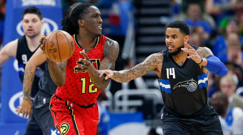 Orlando Magic guard D.J. Augustin (14) chases Atlanta Hawks forward Taurean Prince (12) during the second half of an NBA basketball game in Orlando, Fla., on Saturday, Feb. 25, 2017.The Magic won 105-86. (AP Photo/Reinhold Matay)