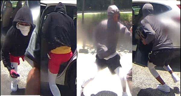 Officials are looking for two people accused of robbing a Cherokee County ATM on Thursday.