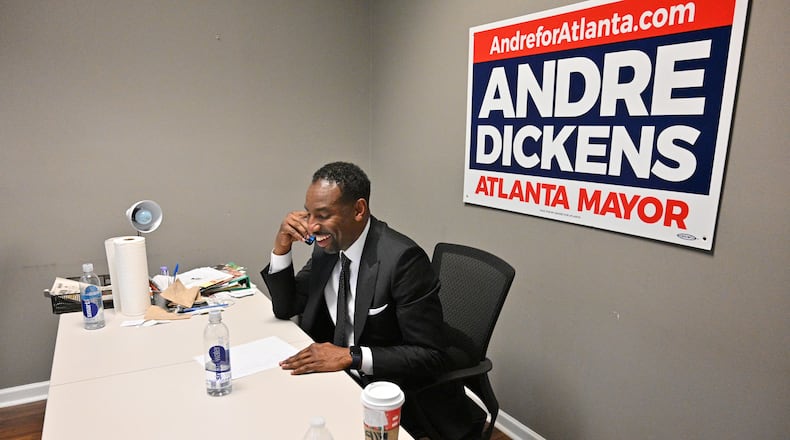 Mayor-elect Andre Dickens makes a phone call the morning after he was elected Atlanta's 61st mayor. (Hyosub Shin / Hyosub.Shin@ajc.com)