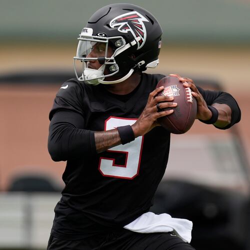 Falcons quarterback Michael Penix Jr. works out during practice on Wednesday, May 27, 2026, in Flowery Branch. Penix is seven months removed from suffering a torn ACL, and admitted Tuesday he still isn’t 100% healthy. (Mike Stewart/AP)