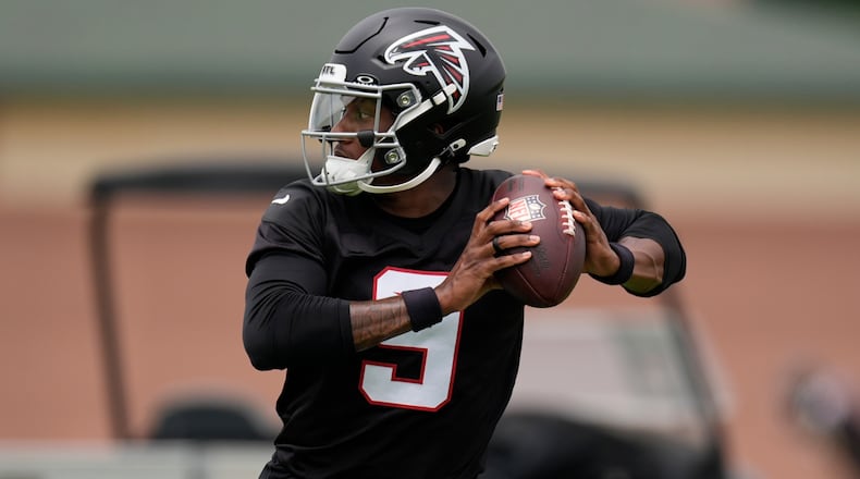 Falcons quarterback Michael Penix Jr. works out during practice on Wednesday, May 27, 2026, in Flowery Branch. Penix is seven months removed from suffering a torn ACL, and admitted Tuesday he still isn’t 100% healthy. (Mike Stewart/AP)