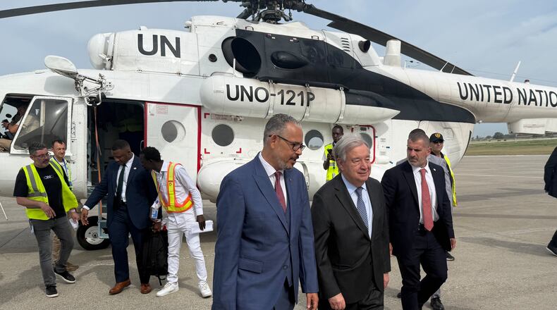 Haitian Prime Minister Alix Didier Fils-Aimé, front center, walks with U.N. Secretary-General Antonio Guterres as Guterres arrives to Port-au-Prince, Haiti, Tuesday, June 16, 2026. (AP Photo/Danica Coto)