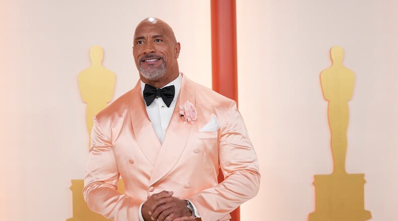 Dwayne Johnson arrives at the Oscars on Sunday, March 12, 2023, at the Dolby Theatre in Los Angeles. (AP Photo/Ashley Landis)