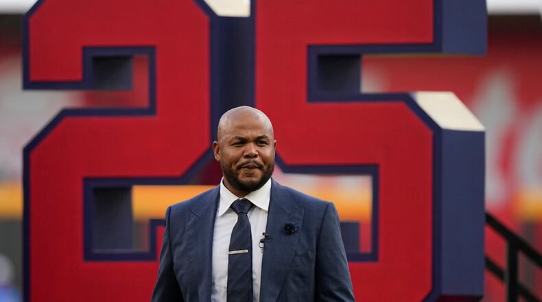 Andruw Jones walks on the field as he is honored, Saturday, Sept. 9, 2023, in Atlanta. Jones who won 10 Gold Gloves in a career that began with 12 seasons in Atlanta, became the 11th Braves player or manager to have his number retired on Saturday night. The honor could add momentum to his candidacy for the Baseball Hall of Fame. Jones' 25 was retired before the Braves' game against the Pittsburgh Pirates. (AP Photo/Brynn Anderson)