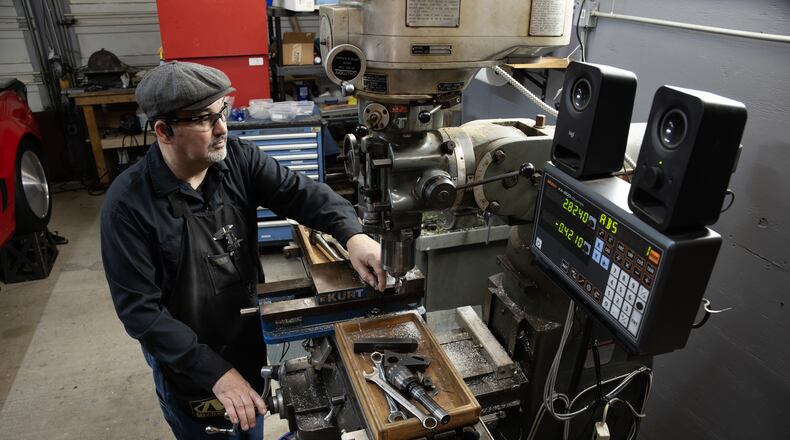 Dan Parker in his Columbus, GA, machine shop. Totally blind following a race car crash in 2013, Parker uses specially adapted tools to create all-metal pens that he sells worldwide. Parker, who attended the Synergies Work EDDIE Awards, was featured in the gala's opening video. He credits the non-profit for helping him grow his business. (Robin Rayne for Zuma Press )