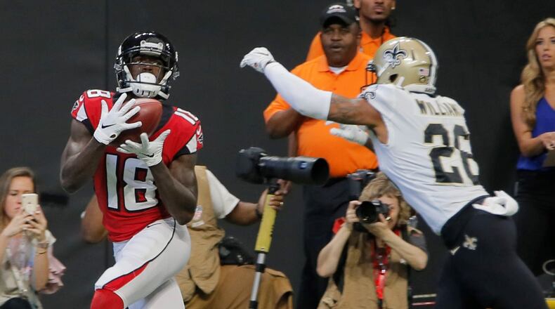Atlanta Falcons wide receiver Calvin Ridley (18) scores his first TD of the day in the first half. The Atlanta Falcons played the New Orleans Saints in an NFL football game Sunday, Sept 23, 2018, at Mercedes-Benz Stadium in Atlanta, GA. BOB ANDRES /BANDRES@AJC.COM