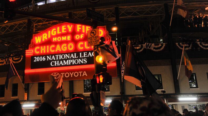 Granted, it is difficult not to be drawn, moth-like, to the lights of victory at the home of the Cubs. (AP Photo/Matt Marton)