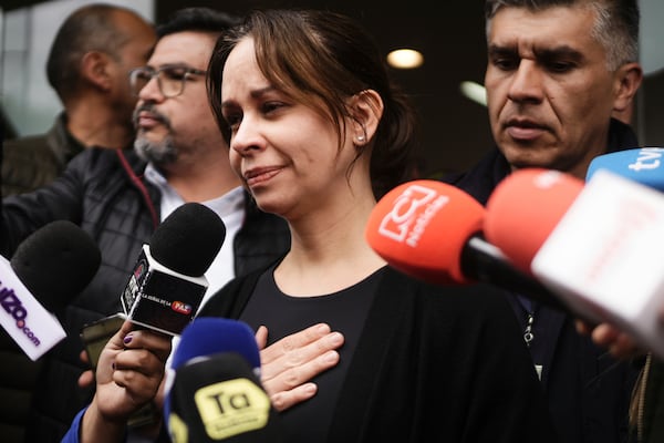 Maria Claudia Tarazona, the wife of Colombian Senator Miguel Uribe Turbay who was shot at a political rally, talks to the press outside the clinic where he is being treated, in Bogota, Colombia, Sunday, June 8, 2025. (AP Photo/Ivan Valencia)