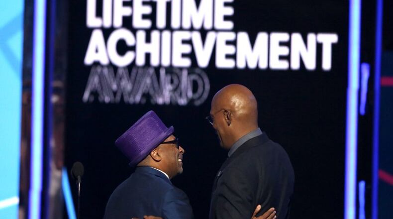 Spike Lee, left, presents the lifetime achievement award to Samuel L. Jackson at the BET Awards at the Microsoft Theater on Sunday, June 26, 2016, in Los Angeles. (Photo by Matt Sayles/Invision/AP)