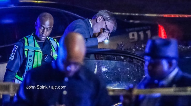 Police in DeKalb County, Georgia, investigate a fatal shooting on Flat Shoals Road on Thursday, Feb. 22, 2018.
