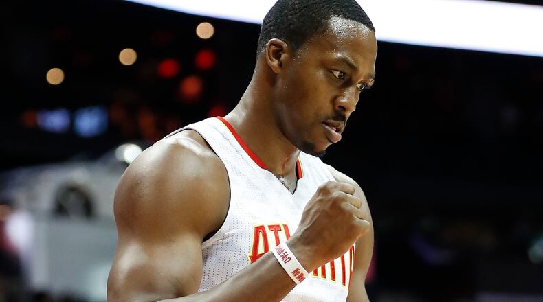 Hawks center Dwight Howard (8) pumps his fist after a basket against the Cavaliers in the first half of a preseason NBA basketball game, Monday, Oct. 10, 2016, in Atlanta. (AP Photo/John Bazemore)