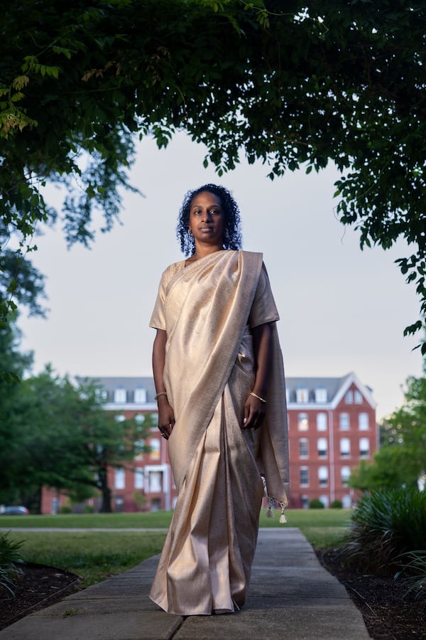 Maya Prabhu, 44, wears a sari at Sisters Chapel at Spelman College, where she graduated, in Atlanta. (Arvin Temkar/AJC)