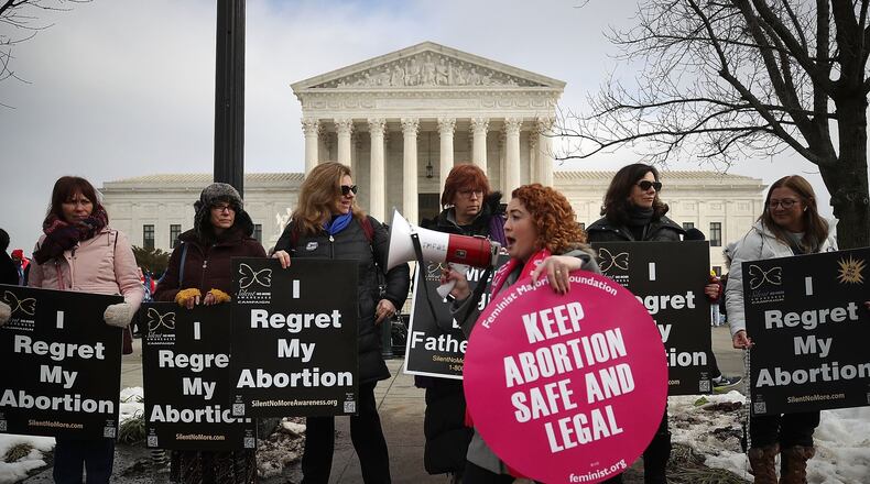 Protesters on both sides of the abortion issue gather in front of the U.S. Supreme Court building during the Right To Life March, in January in Washington, D.C. (Photo by Mark Wilson/Getty Images)