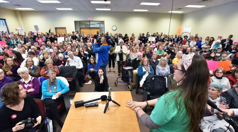 Dr. Michelle Golden (foreground) speaks at a congressional event that turned into a stand against Donald Trump's policies in Greensboro. HYOSUB SHIN / HSHIN@AJC.COM