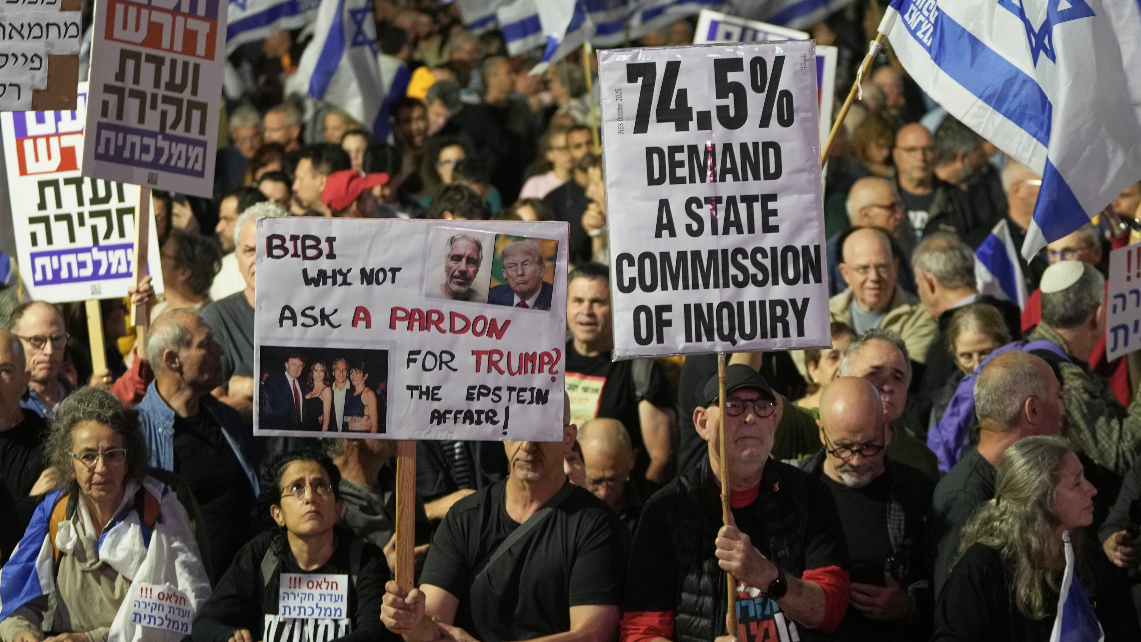 People take part in a protest against Prime Minister Benjamin Netanyahu's government and call for a state commission of inquiry to investigate the events of the Hamas militant group attack of October 7, 2023, as they gather at Habima square, in Tel Aviv, Israel, Saturday, Nov. 15, 2025. (AP Photo/Mahmoud Illean)