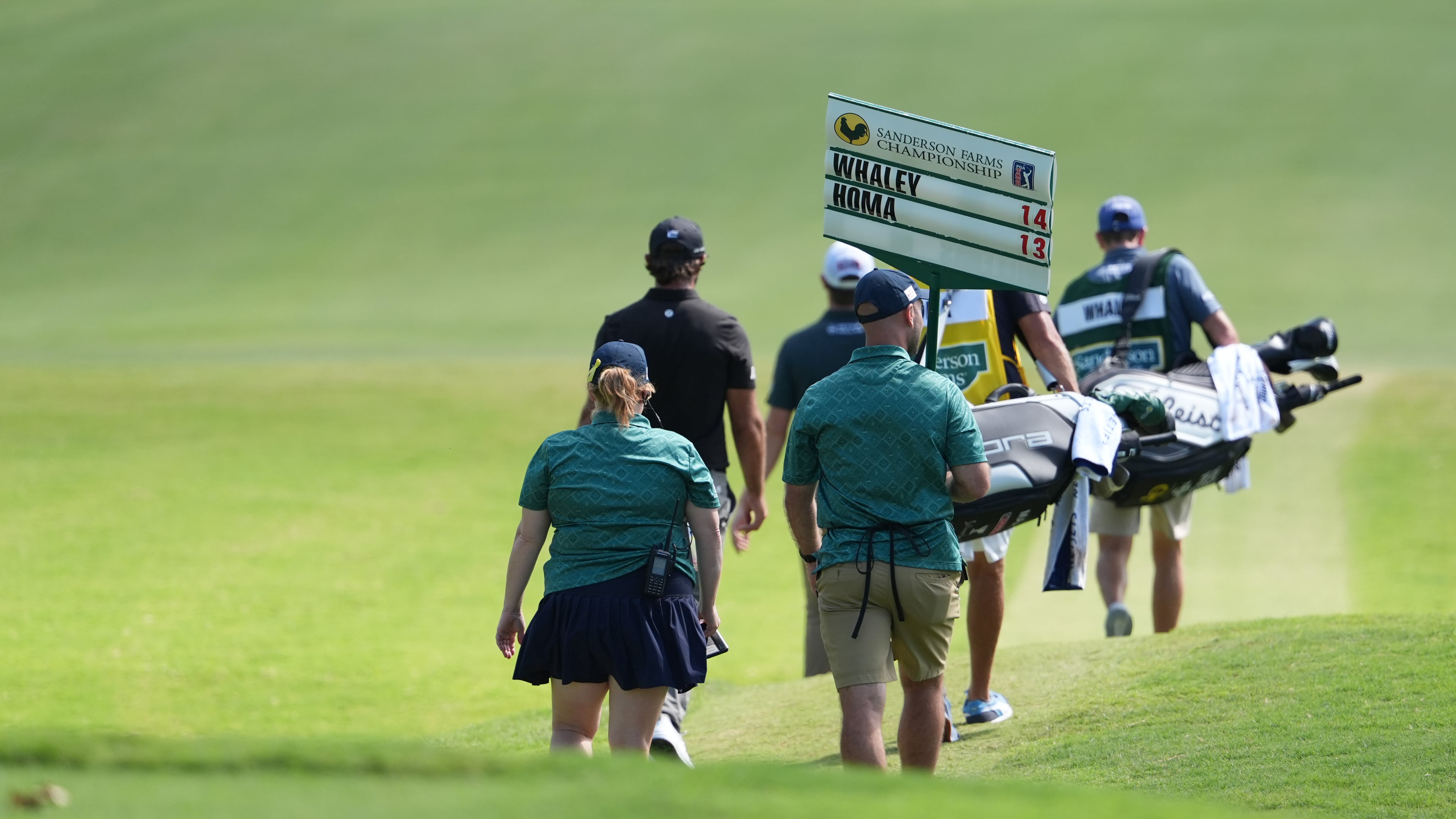 The group of Vince Whaley and Max Homa walks down the No. 1 fairway during the fourth round of the Sanderson Farms Championship golf tournament, Sunday, Oct. 5, 2025, in Jackson, Miss. (AP Photo/Rogelio V. Solis)
