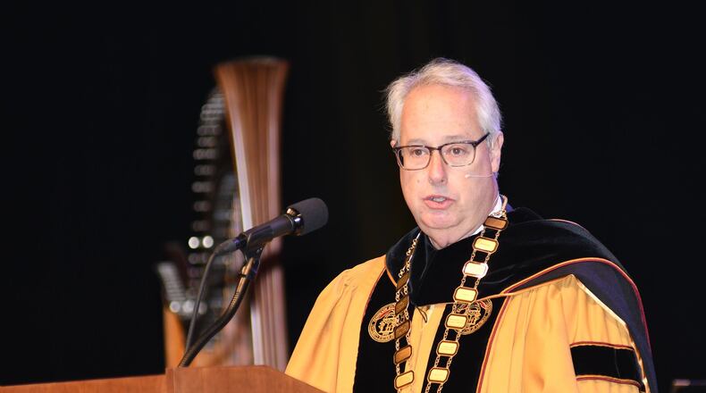 Kennesaw State University president Sam Olens speaks during the investiture ceremony at KSU on October 19, 2017. The ceremony came as Olens was under fire over cheerleaders kneeling during the national anthem. (Rebecca Breyer)