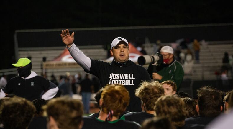 Chris Prewett, head varsity football coach for Roswell, speaks to his team after their victory against Mill Creek on Friday, November 27, 2020, at Roswell High School in Roswell, Georgia. Roswell defeated Mill Creek 28-27. CHRISTINA MATACOTTA FOR THE ATLANTA JOURNAL-CONSTITUTION