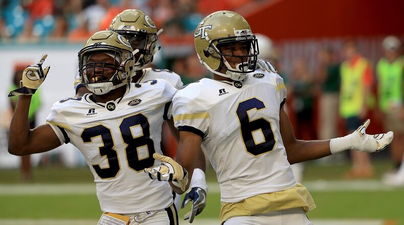 Georgia Tech's Lamont Simmons (6) celebrates his 42-yard touchdown return of an onside kick against Miami Saturday.  (Mike Ehrmann/Getty Images)