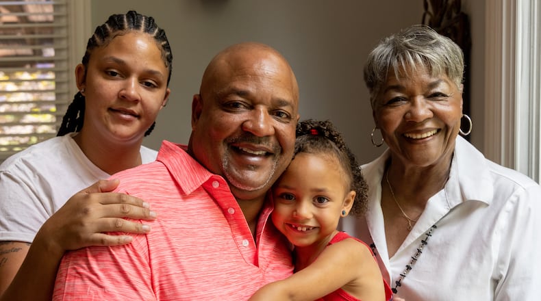 Alexis Scott (from left) with her father Rufus, sister Stella (age 5) and grandmother Essie. Rufus Scott is a heart transplant recipient who has reached out to his donor family.  PHIL SKINNER FOR THE ATLANTA JOURNAL-CONSTITUTION.