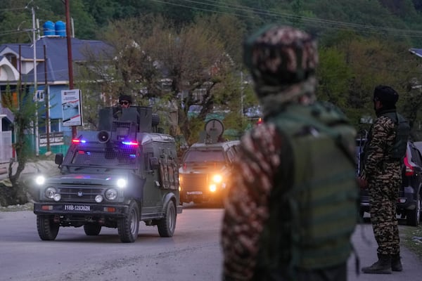 Indian security officers patrol in armored vehicle near Pahalgam in south Kashmir after assailants indiscriminately opened fired at tourists visiting Pahalgam, Indian controlled Kashmir, Tuesday, April 22, 2025.(AP Photo/Dar Yasin)