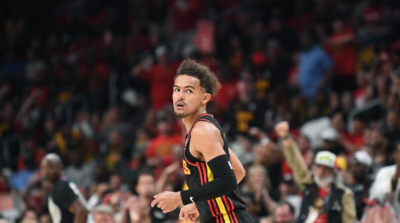 Hawks guard Trae Young reacts after scoring during the first half in Game 4. Young finished with nine points in Atlanta's 110-86 loss. (Hyosub Shin / Hyosub.Shin@ajc.com)