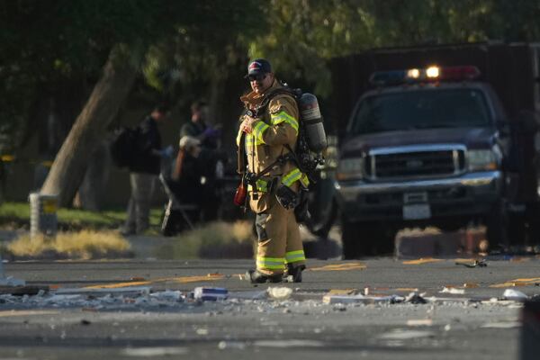 FILE - A firefighter stands at the scene of an explosion in Palm Springs, Calif., on Saturday, May 17, 2025. (AP Photo/Eric Thayer, File)