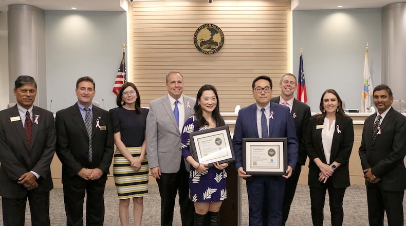 The Johns Creek City Council recently recognized Community Development Director Ben Song and Community Development Deputy Director Yang Chen for their work on the Town Center Vision & Plan. COURTESY CITY OF JOHNS CREEK