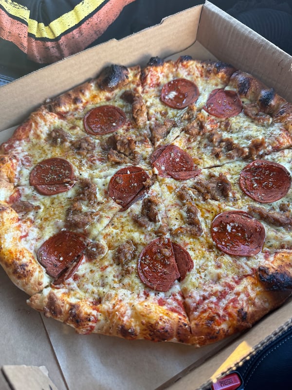 A traditional-looking pepperoni pizza in a box