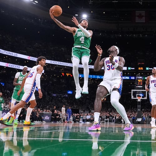 Boston Celtics guard Anfernee Simons (4) drives to the basket against the Philadelphia 76ers during the first half of an NBA basketball game, Wednesday, Oct. 22, 2025, in Boston. (AP Photo/Charles Krupa)
