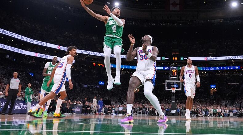 Boston Celtics guard Anfernee Simons (4) drives to the basket against the Philadelphia 76ers during the first half of an NBA basketball game, Wednesday, Oct. 22, 2025, in Boston. (AP Photo/Charles Krupa)