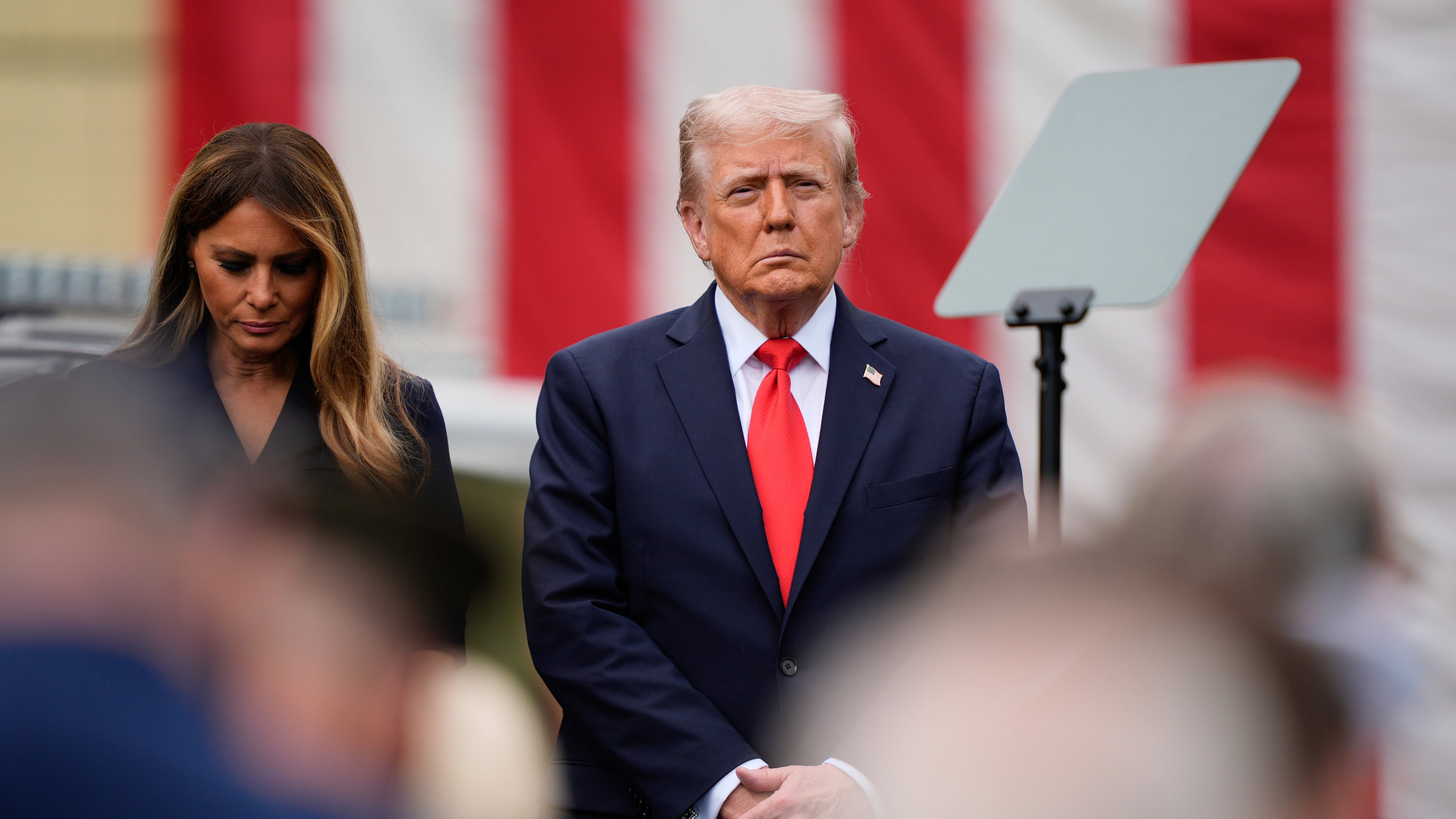President Donald Trump, right, and first lady Melania Trump attend a ceremony in the Pentagon courtyard to commemorate the 24th anniversary of the 9/11 attacks, Thursday, Sept. 11, 2025, in Washington. (AP Photo/Julia Demaree Nikhinson)