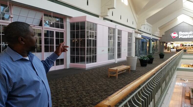 Gwinnett Place mall has seen increasingly rocky times in recent years, with the departure of more national retailers and shrinking sales. The current owners say plans for a major redevelopment have been delayed but are still expected. Shawl Pryor, a senior vice president for Moonbeam Leasing & Management, said part of the work will convert some vacant store spaces into offices. MATT KEMPNER / AJC