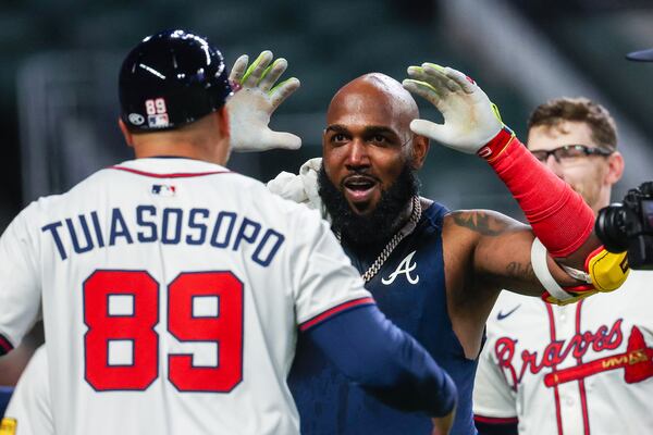 Braves designated hitter Marcell Ozuna (center) celebrates his walk-off homer against the Phillies.