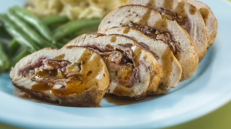 A butter-enriched wine sauce coats fig- and cheese-stuffed chicken. (Bill Hogan/Chicago Tribune/TNS)