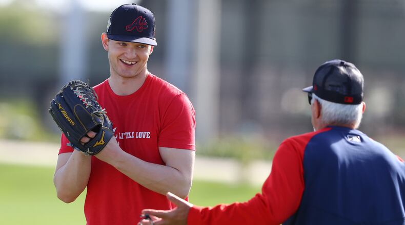 Atlanta Braves injured pitcher Mike Soroka, recovering from a Achilles tendon tear, works with pitching coach Rick Kranitz the first day of team practice at Spring Training on Monday, March 14, 2022, in North Port. Curtis Compton / Curtis.Compton@ajc.com