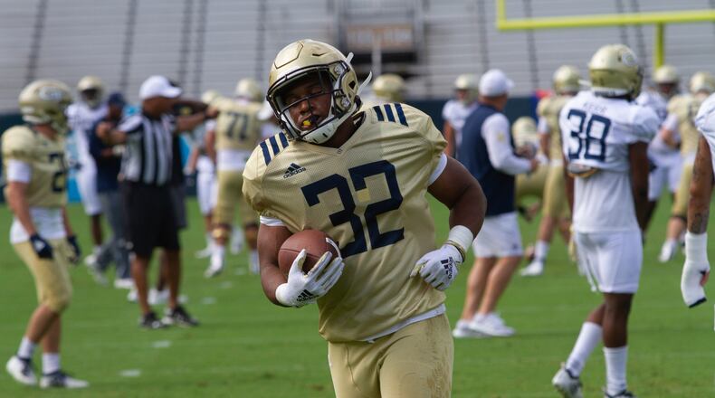 Devin Ellison runs the ball during Georgia Tech's football practice at Bobby Dodd Stadium Saturday, August 3, 2019.
STEVE SCHAEFER / SPECIAL TO THE AJC