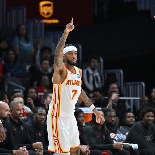 Atlanta Hawks guard Nickeil Alexander-Walker (7) reacts after scoring during the first half in a preseason NBA basketball game at State Farm Arena, Thursday, October 16, 2025, in Atlanta. Houston Rockets won 133-115 over Atlanta Hawks. (Hyosub Shin / AJC)