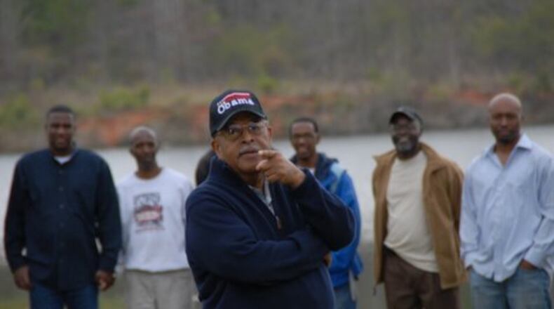 The Rev. Cameron Madison Alexander, who will mark 60 years of preaching and 45 years of pastoring Antioch Baptist Church North on Aug. 3, talks with addicts at the church’s Land of Promise, a recovery ministry in Culloden, GA. “I’m excited to get to see how the Lord is going to take care of all the people left in the wake of the moving of the two churches,” the Rev. Alexander said. “These were very powerful churches. Mt. Vernon had awesome outreach. Friendship was a historical anchor.” PHOTO/DARRYL SPEED