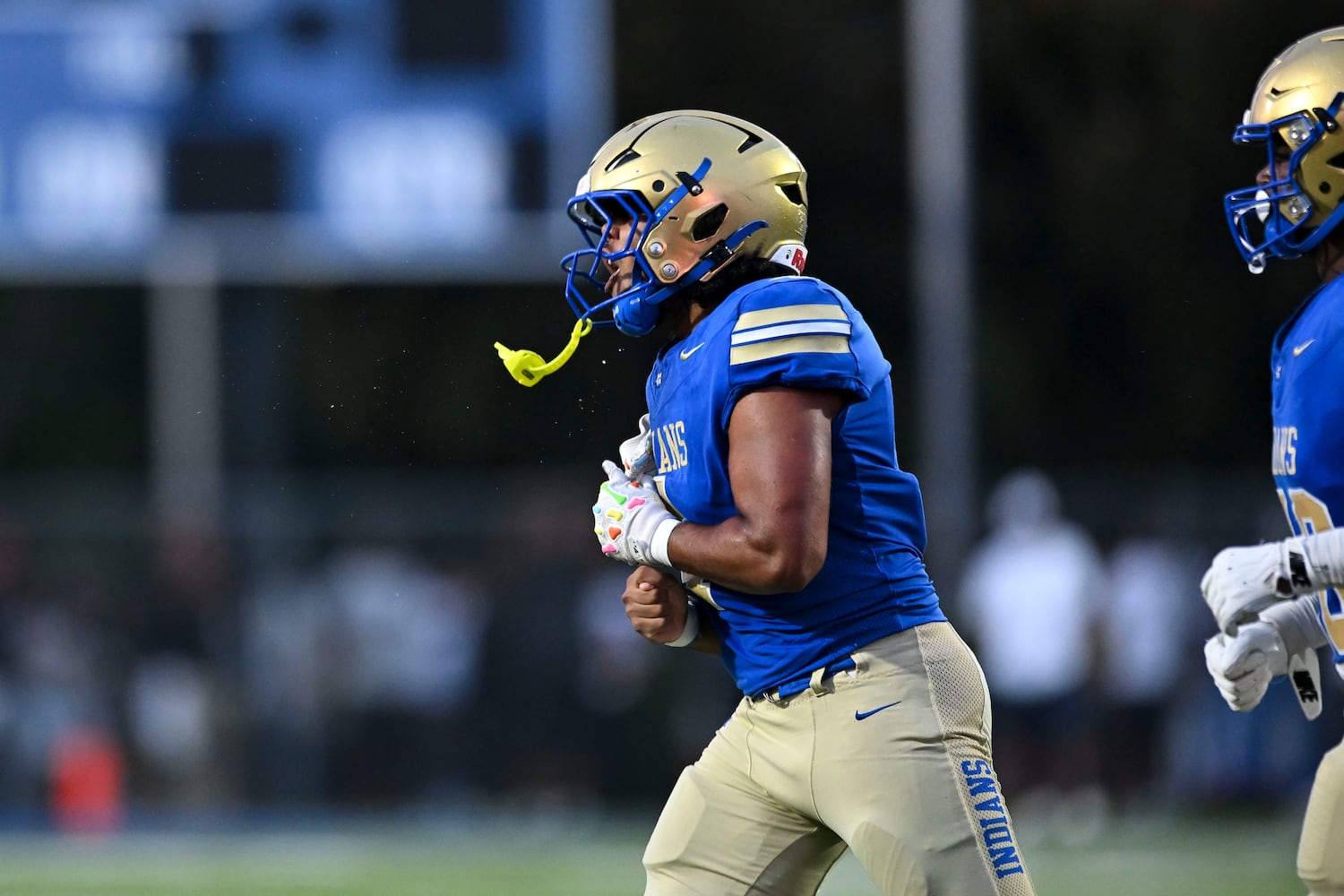 McEachern running back Henry Pullen (4) reacts to scoring the Indians’ first touchdown against North Cobb during the first half of play Friday, August 22, 2025 at McEachern.  (Daniel Varnado/For the Atlanta Journal-Constitution)