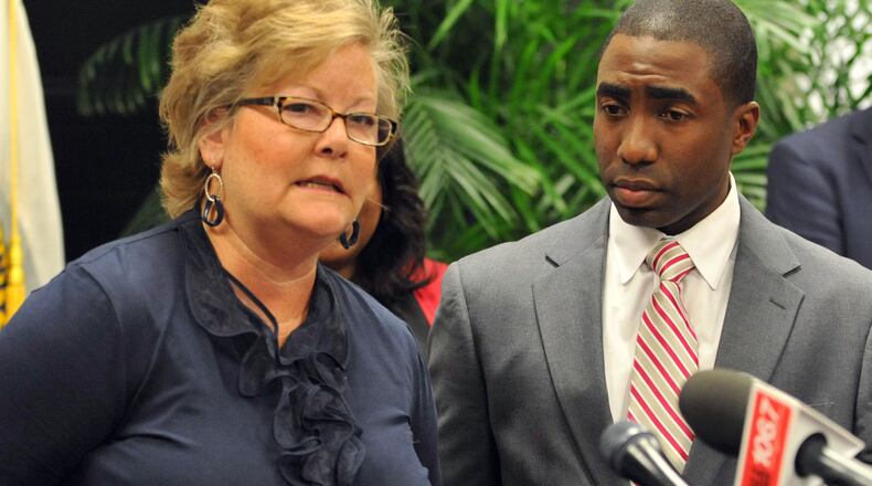 DeKalb County's six sitting county commissioners (including Elaine Boyer, left) and interim CEO Lee May (at right), who was a commissioner during the 2011 incidents, denied being the official called a "councilman" in a 51-count indictment mentioning "an elected official" in DeKalb.