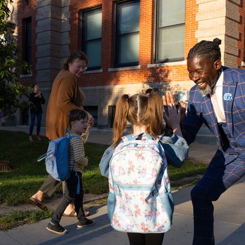 FILE - Ian Roberts, superintendent of Des Moines Public Schools, greets students at Greenwood Elementary School in Des Moines, Aug. 25, 2025. (Jon Lemons/Des Moines Public Schools via AP)