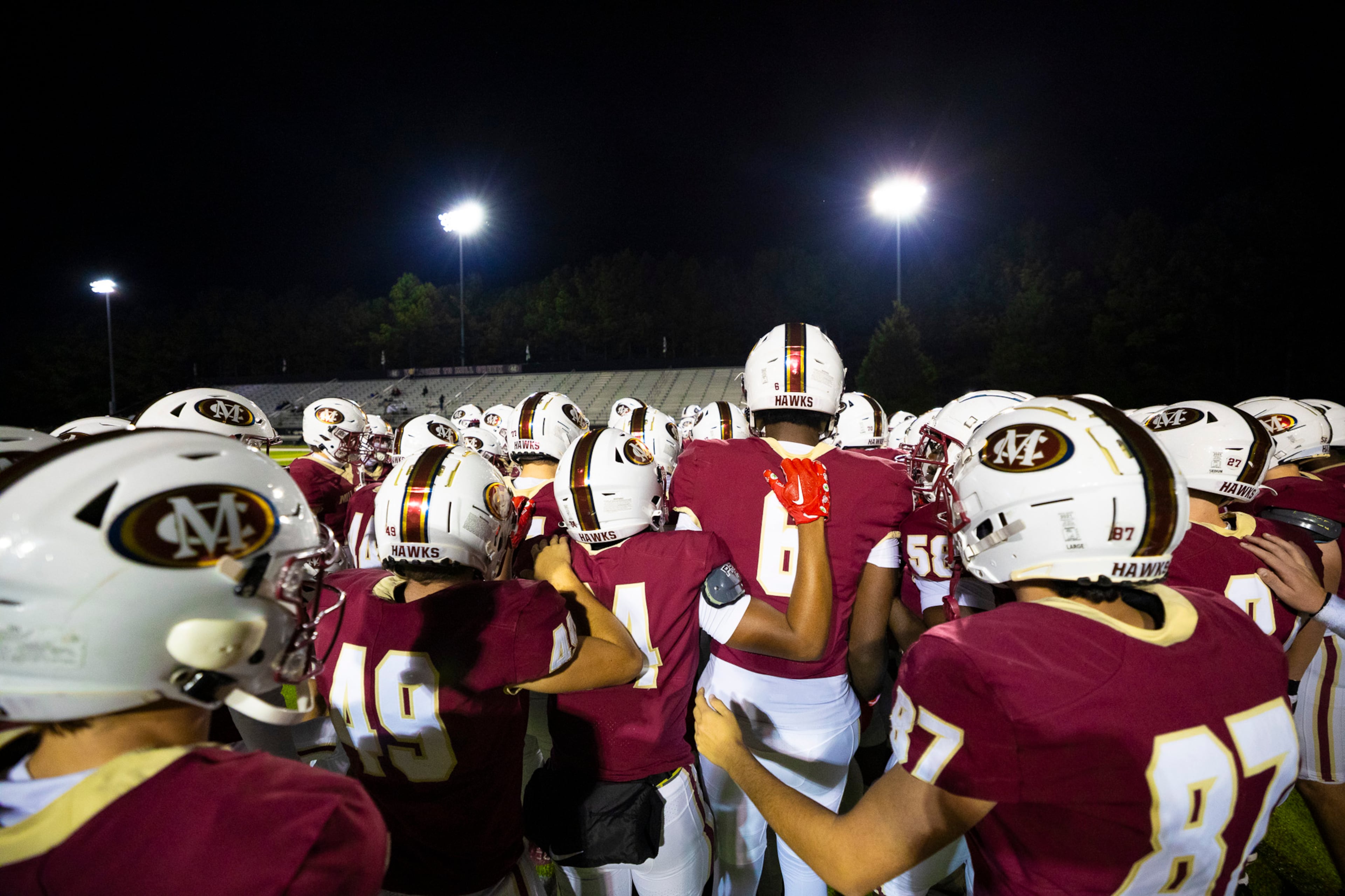 Mill Creek players huddle during warmups against Colquitt at Mill Creek Community Stadium in Hoschton on Nov. 14th, 2025. (Oscar Guevara Saenz for the AJC)