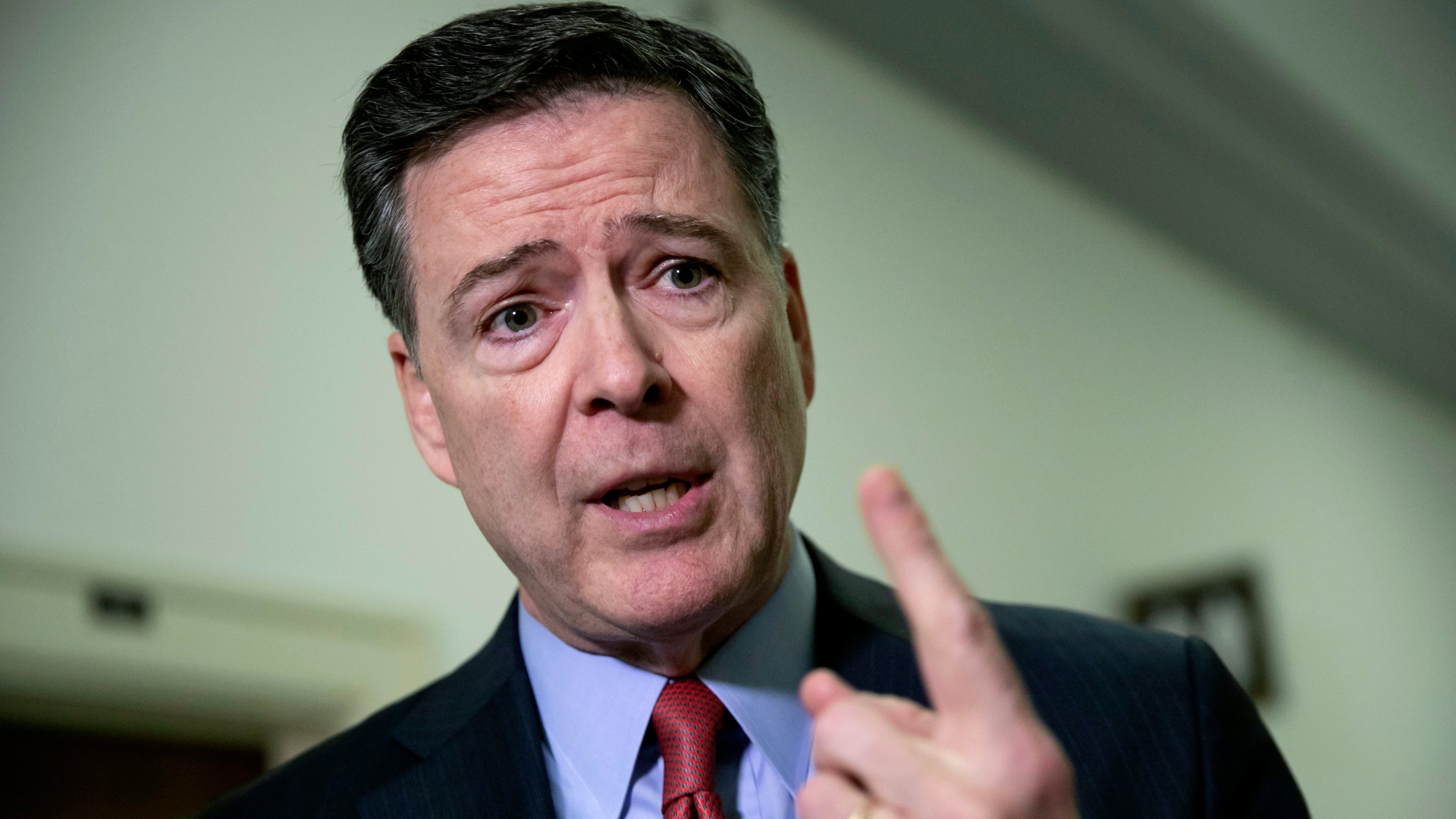 FILE - Former FBI Director James Comey speaks to reporters on Capitol Hill Washington, Dec. 17, 2018. AP Photo/J. Scott Applewhite, File)