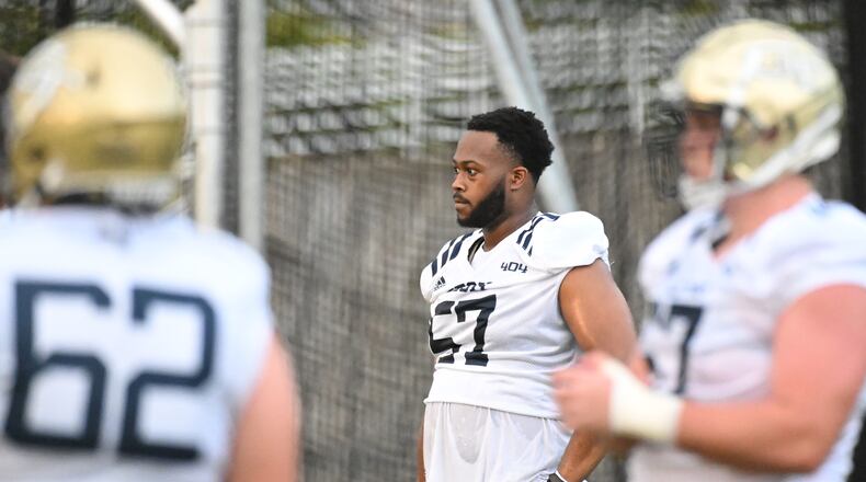 August 5, 2022 Atlanta - Georgia Tech's offensive lineman Paul Tchio (57) takes a break during the first football practice of the season at Rose Bowl Field on Georgia Tech Campus in Atlanta on Friday, August 5, 2022. (Hyosub Shin / Hyosub.Shin@ajc.com)