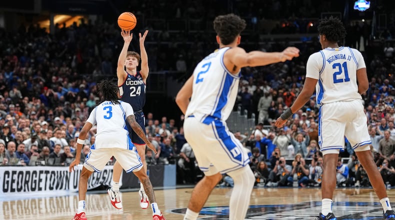 UConn guard Braylon Mullins (24) scores the winning basket during the second half against Duke in the Elite Eight of the NCAA college basketball tournament, Sunday, March 29, 2026, in Washington. (AP Photo/Abbie Parr)