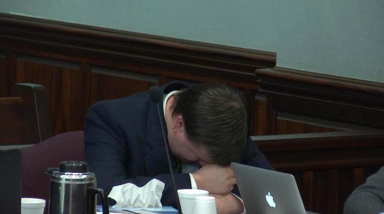 Justin Ross Harris breaks down while listening to a description of what his son's Cooper would have felt in the final hours before his death. Brian Frist, who in 2014 was the Cobb County Chief Medical Examiner, had been testifying during the murder trial of Justin Ross Harris at the Glynn County Courthouse in Brunswick, Ga., on Tuesday, Oct. 18, 2016. (screen capture via WSB-TV)