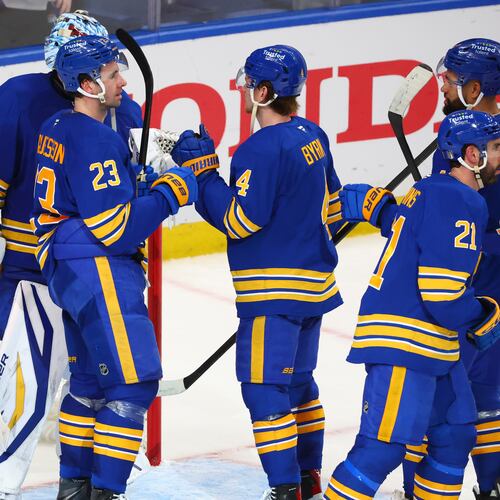 Buffalo Sabres players celebrate victory following the third period in Game 1 of a first-round NHL hockey Stanley Cup playoff series against the Boston Bruins, Sunday, April 19, 2026, in Buffalo, N.Y. (AP Photo/Jeffrey T. Barnes)
