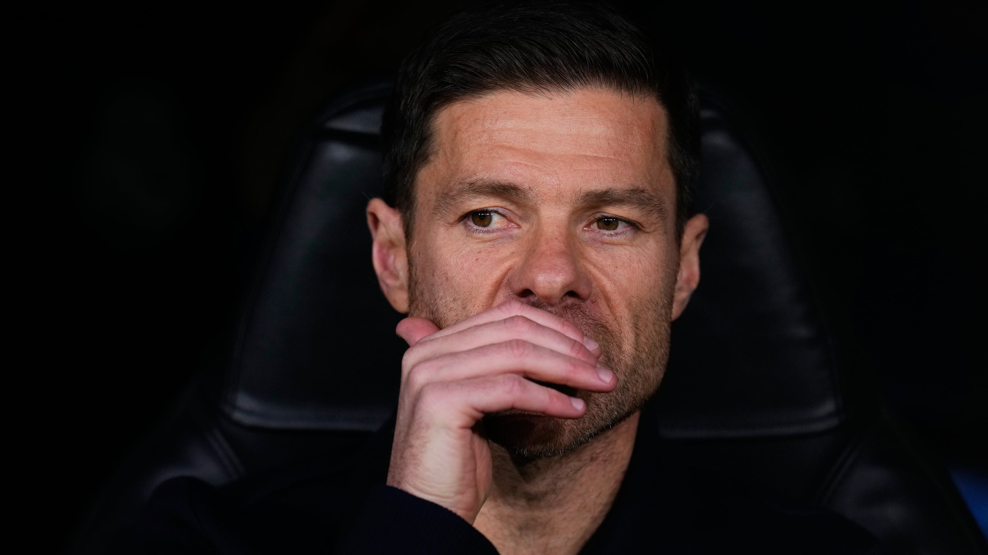 Real Madrid's head coach Xabi Alonso sits at the bench before a Champions League opening phase soccer match between Real Madrid and Manchester City, in Madrid, Spain, Wednesday, Dec. 10, 2025. (AP Photo/Manu Fernandez)
